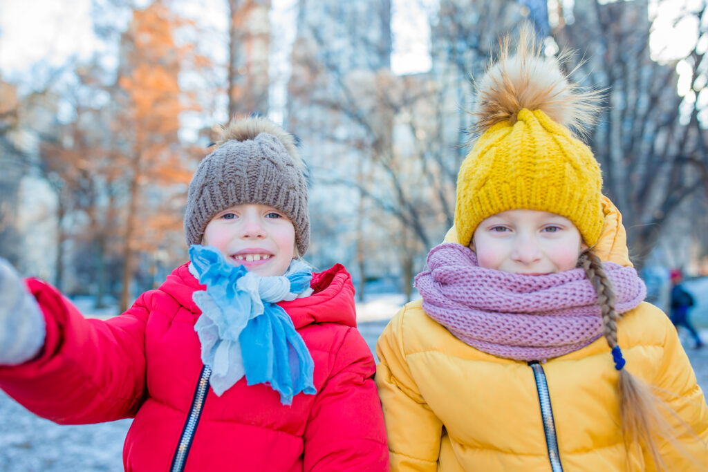 Children dressed for winter snow in Canada